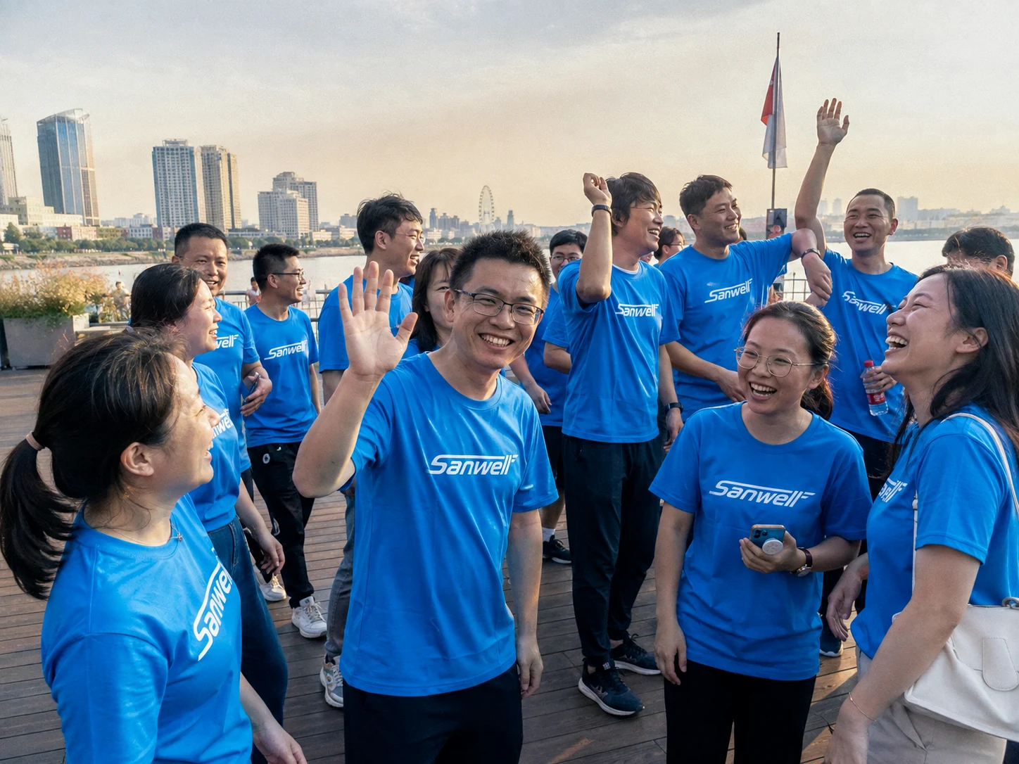 SANWELL LOGISTICS team members smiling during an outdoor team activity